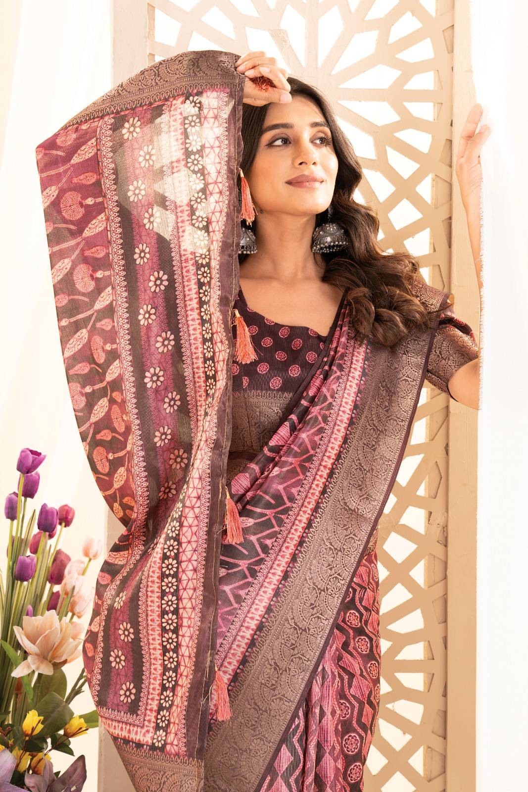 Tusser silk saree with Ajrak digital print and finished with fancy latkans.