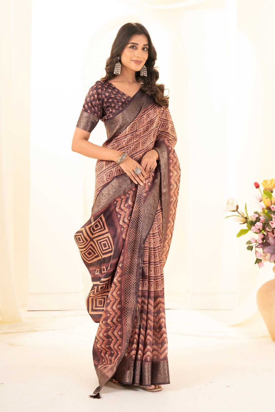 Tusser silk saree with Ajrak digital print and finished with fancy latkans.