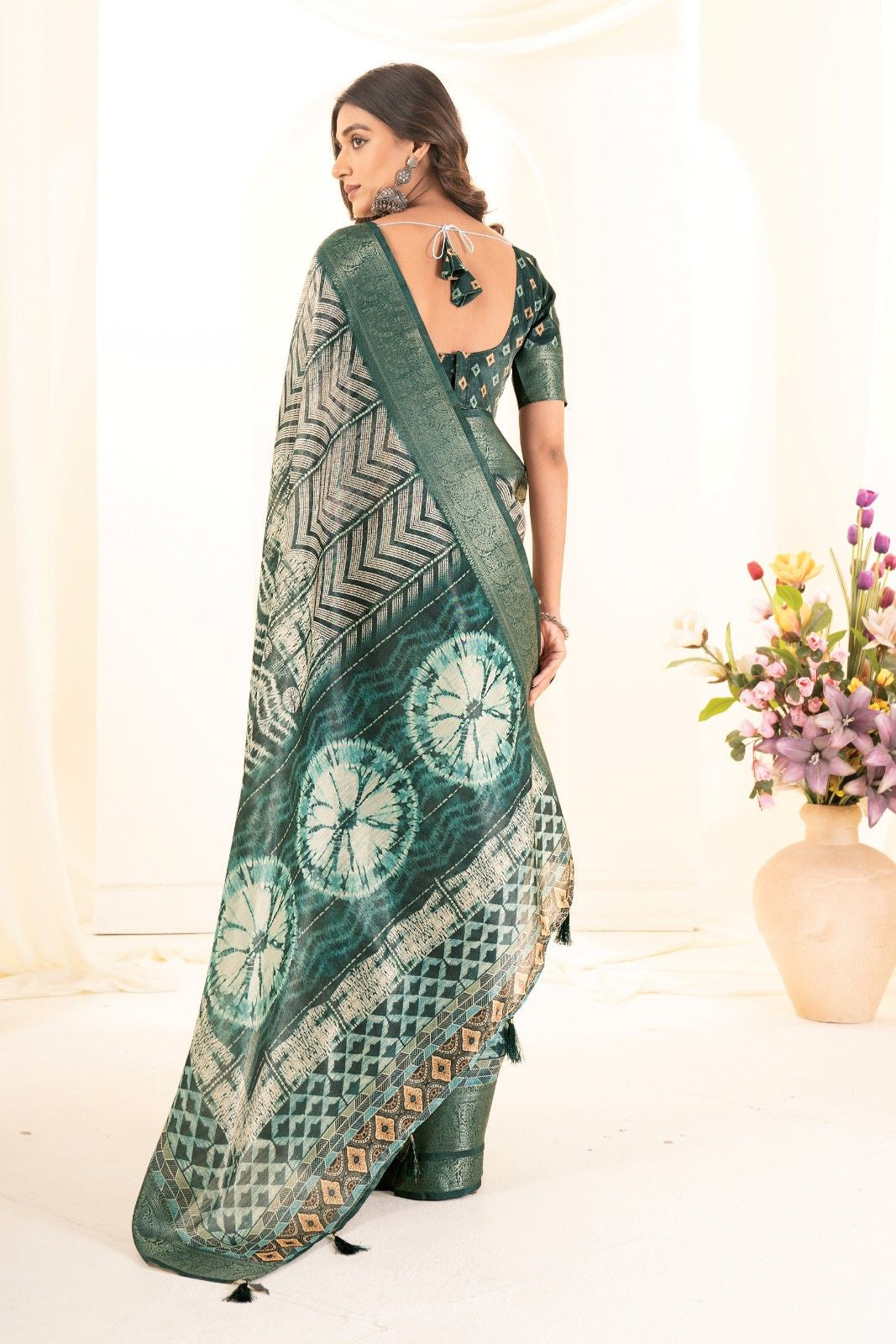 Tusser silk saree with Ajrak digital print and finished with fancy latkans.