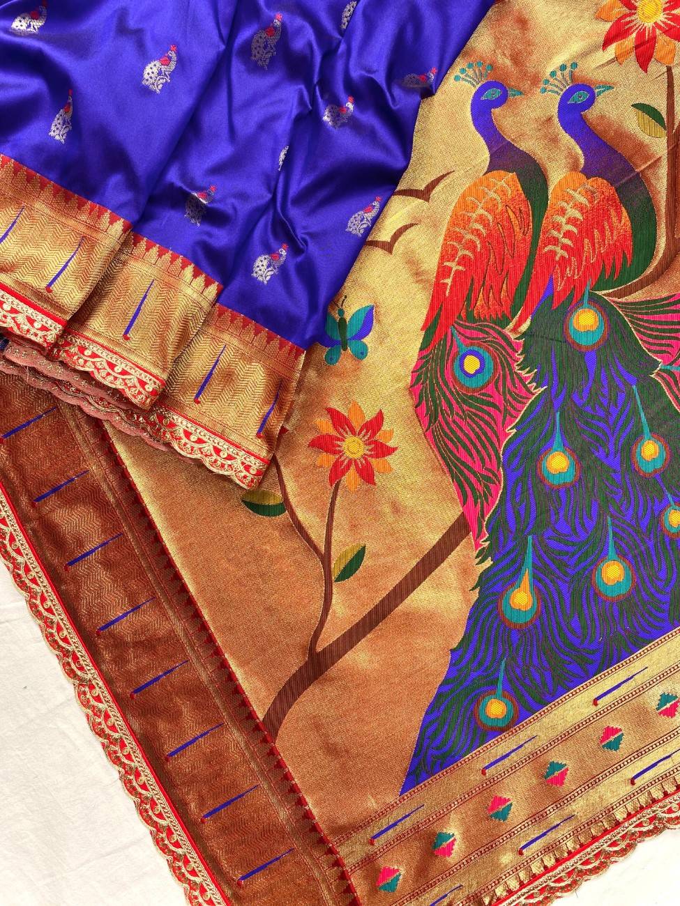 Pure Paithani silk saree with all-over meenakari weaving, vibrant contrast peacock pallu